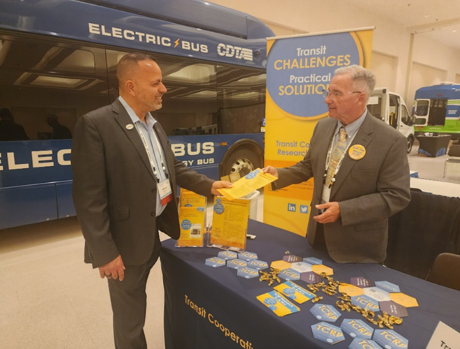 Ed Watt sharing TCRP information with a conference attendee