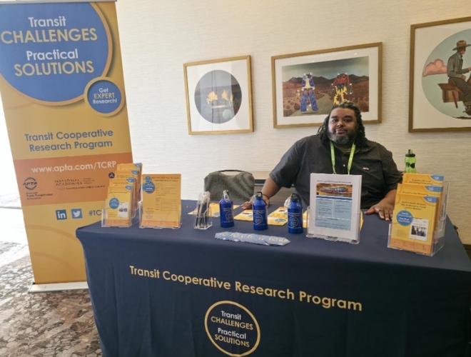 Yannis Banks sitting at a TCRP table as an Ambassador